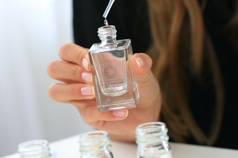 close up of a bottle being filled with fragrance on a day with a perfumer experience day