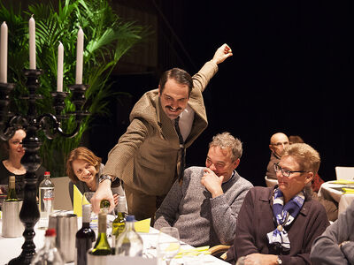 basil pours wine for diners as part of the faulty towers the dining experience in london