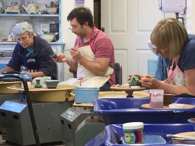 people on a pottery course experience day at eastnor pottery