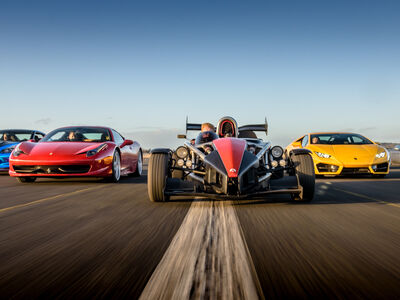 a selection of supercars on a race track at car chase heroes driving experience day