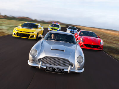 five cars on a race track for an all star track day driving experience