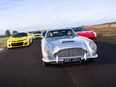 four cars on a race track for a junior all star track day experience