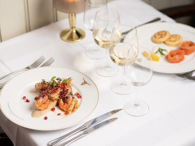 two meals laid out on a table for two at marco pierre white's london steakhouse company