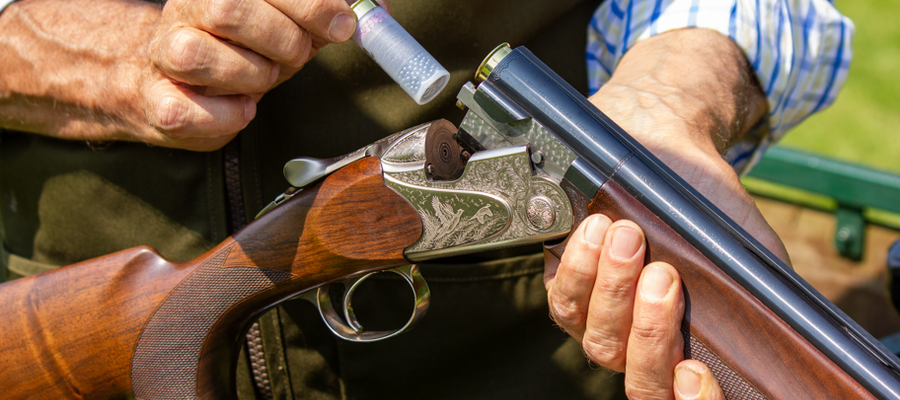 a man reloading a gun as part of a clay pigeon shooting experience available nationally