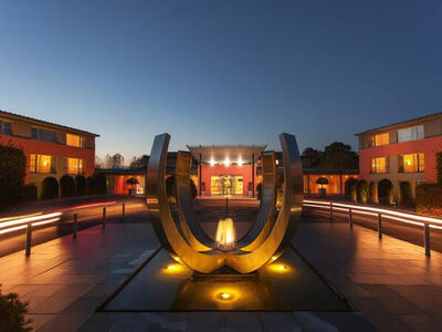 the sculpture outside the crowne plaza marlow hotel lit up at night