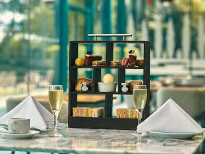 afternoon tea set up on a table at the crowne plaza hotel in marlow
