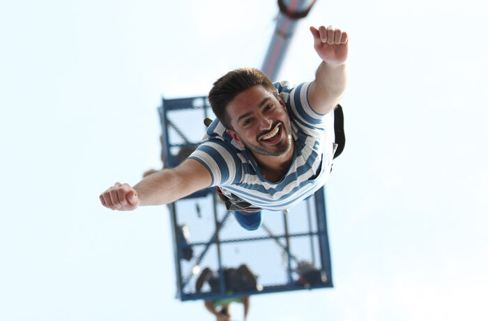 man doing a bungee jump on a bungee jump experience day