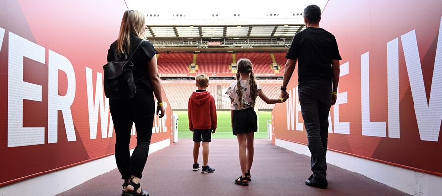 family walking through the players tunnel on the liverpool fc stadium tour
