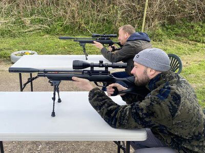 2 people on an air rifle shooting experience with rapid airgun training