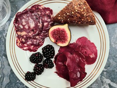 plate of charcuterie with fruit and bread made on a charcuterie making course with bray cured
